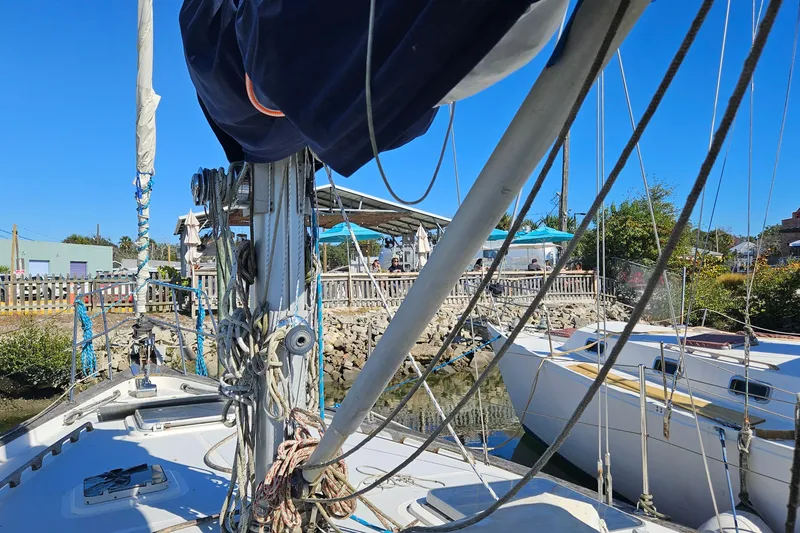 Slide: The Image of Sailboat ENDEAVOR 42, 1989 model, docked at marina with clear blue sky. - 25
