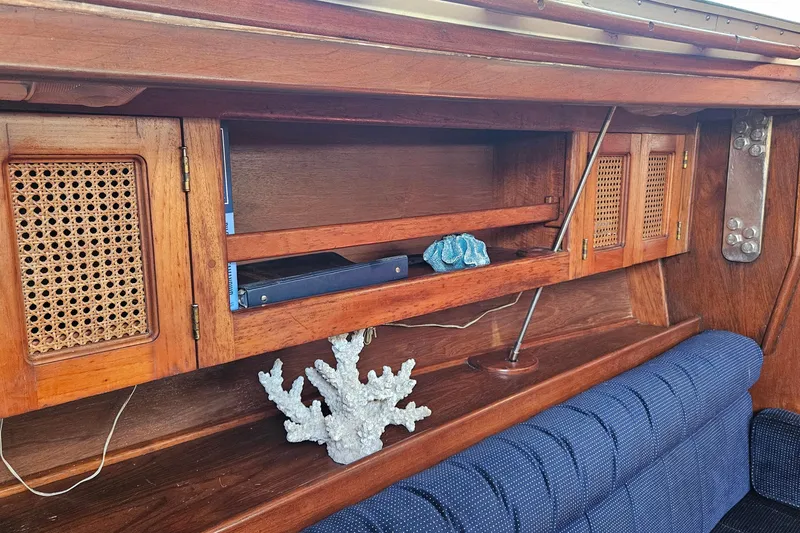 Slide: The Image of Wooden interior of 1989 ENDEAVOR 42 yacht with decorative coral and blue upholstery. - 35