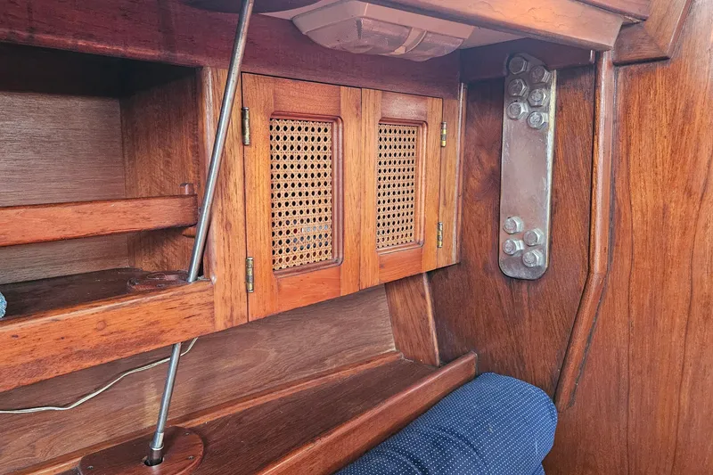 Slide: The Image of Interior of 1989 ENDEAVOR 42 sailboat with wooden cabinetry and metal fittings. - 36