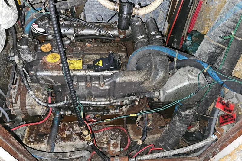 Slide: The Image of Engine compartment of a 1989 ENDEAVOR 42, showing various hoses and components. - 39