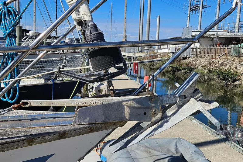 Slide: The Image of Sailboat docked with anchor, featuring ENDEAVOR 42 model from 1989. - 5