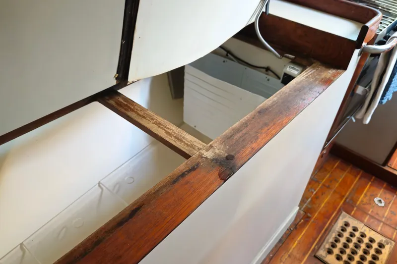 Slide: The Image of Open storage compartment on 1989 ENDEAVOR 42 boat with wooden trim and visible interior. - 52