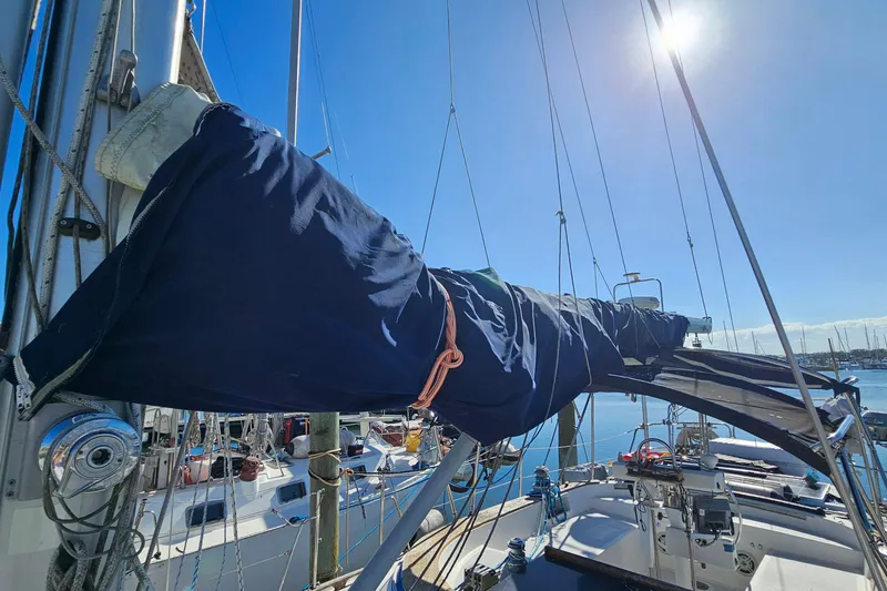 Slide: The Image of Sailboat deck view of 1989 ENDEAVOR 42 under bright blue sky. - 67