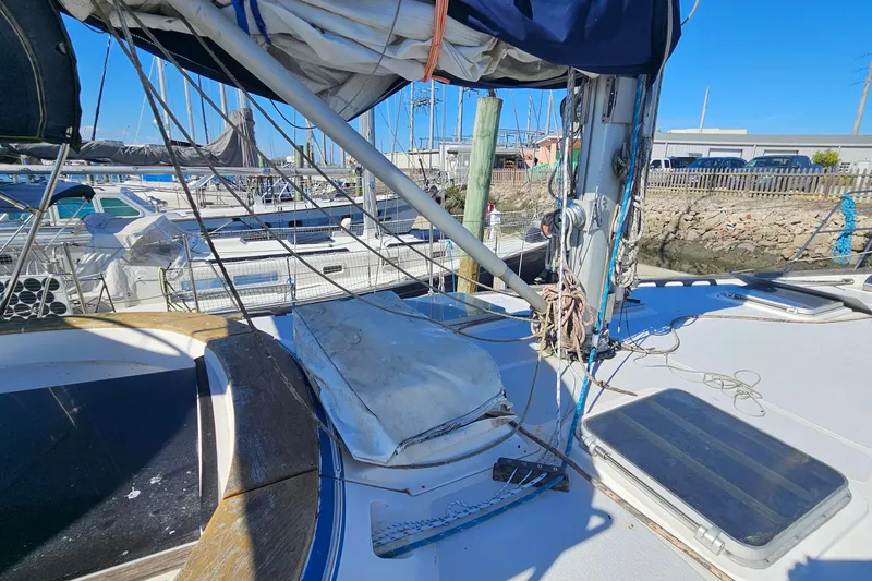 Slide: The Image of Sailboat deck view, ENDEAVOR 42, 1989 model, docked in marina under clear blue sky. - 68