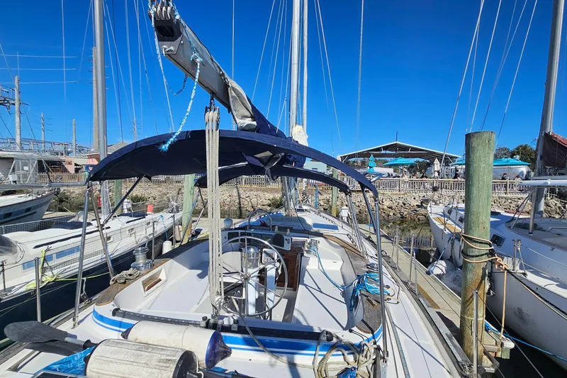 Slide: The Image of 1989 ENDEAVOR 42 sailboat docked at marina under clear blue sky. - 9
