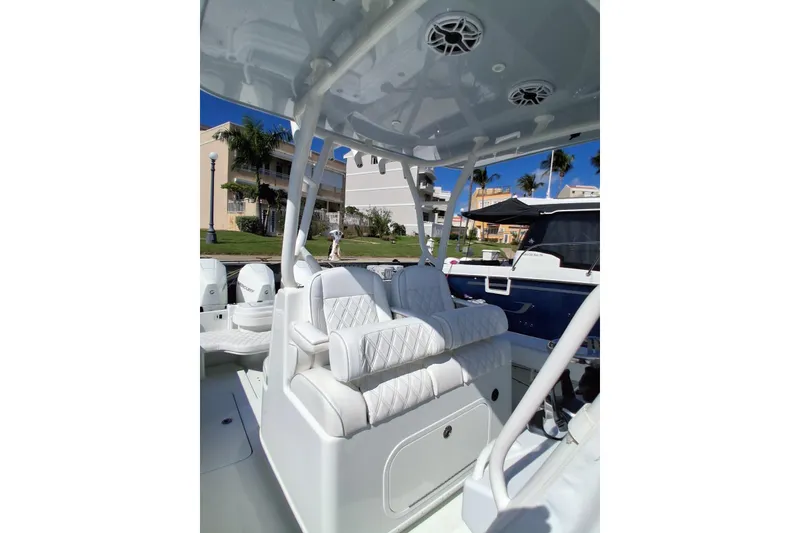 Slide: The Image of 2023 Yellowfin 36 Offshore boat interior with white seating and modern design. - 4