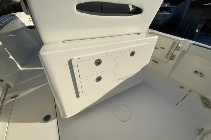 Slide: The Image of 2026 Cobia 245 Center Console boat interior with storage compartments. - 19