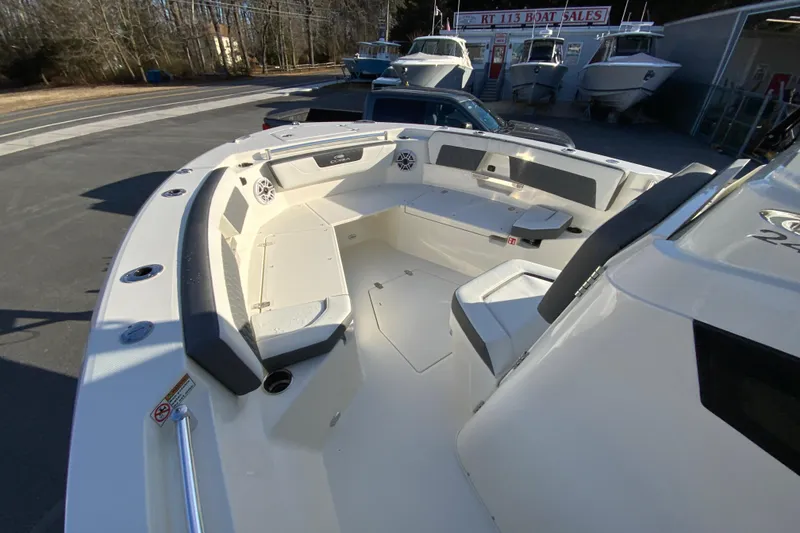 Slide: The Image of 2026 Cobia 245 Center Console boat with spacious seating and modern design. - 24