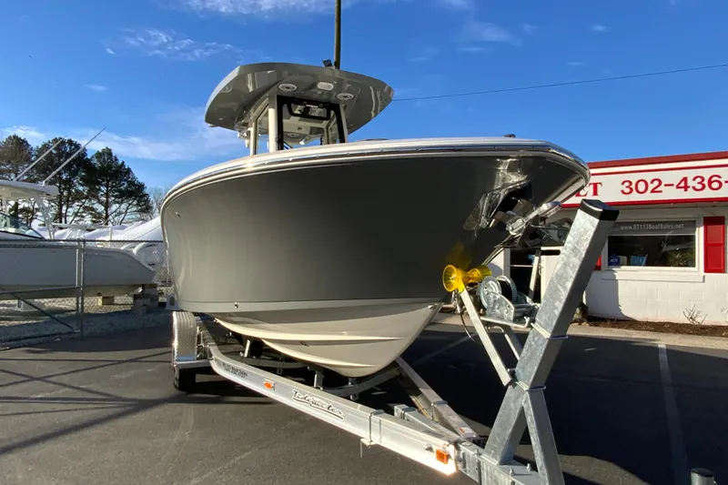Slide: The Image of 2026 Cobia 245 Center Console boat on trailer at dealership. - 3