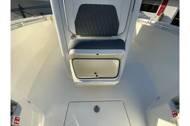 Slide: The Image of 2026 Cobia 245 Center Console boat interior with seating and storage compartment. - 31