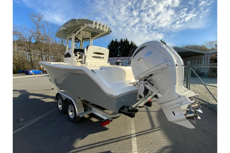 Slide: The Image of 2026 Cobia 245 Center Console boat with Yamaha engine on trailer. - 8