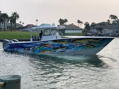 The Image of 2018 Yellowfin 39 Offshore boat with colorful fish design. - 0