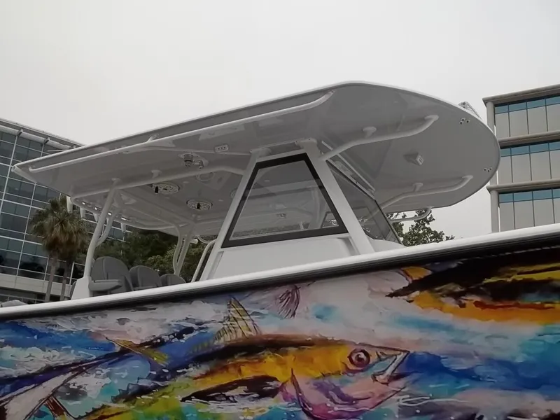 Slide: The Image of 2018 Yellowfin 39 Offshore with colorful fish artwork. - 3