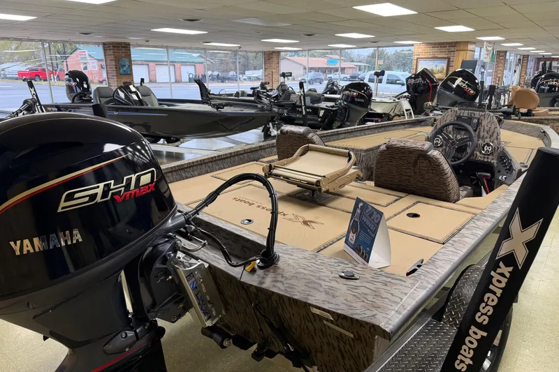 Slide: The Image of 2026 Xpress H18C Crappie boat with Yamaha SHO VMAX engine in showroom. - 2