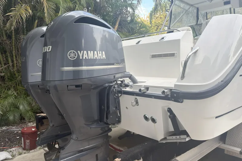 Slide: The Image of Interior of 2001 Boston Whaler 285 Conquest boat, featuring helm and seating area. - 10