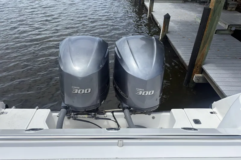 Slide: The Image of Twin Yamaha 300 engines on a 2001 Boston Whaler 285 Conquest at dockside. - 15