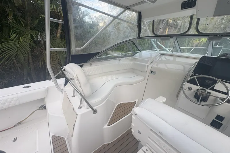 Slide: The Image of Interior view of a 2001 Boston Whaler 285 Conquest boat with helm and seating. - 9