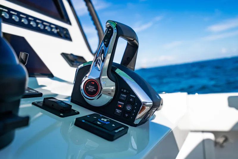Slide: The Image of Control panel of 2026 Reef Runner 340 boat with ocean view. - 15