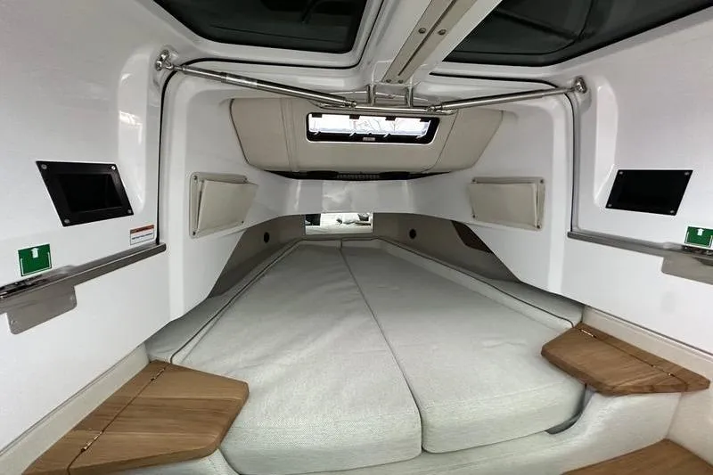 Slide: The Image of 2025 Axopar 37 XC Cross Cabin interior with cozy sleeping area and modern design. - 16