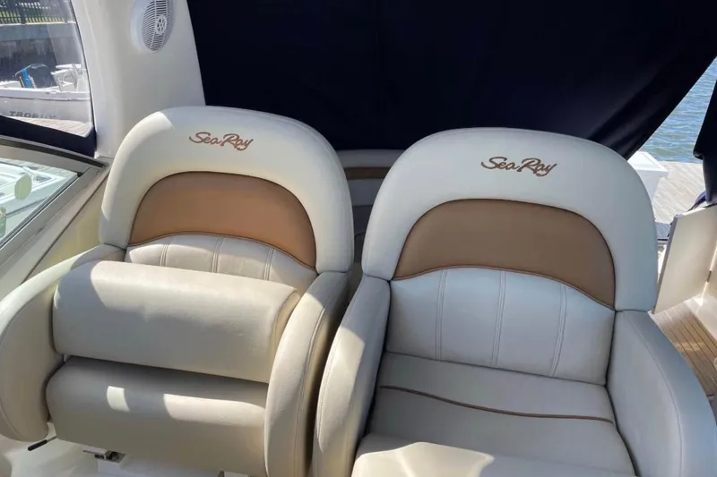 Slide: The Image of Luxury seating on 2006 Sea Ray 340 Sundancer boat, featuring branded upholstery. - 9
