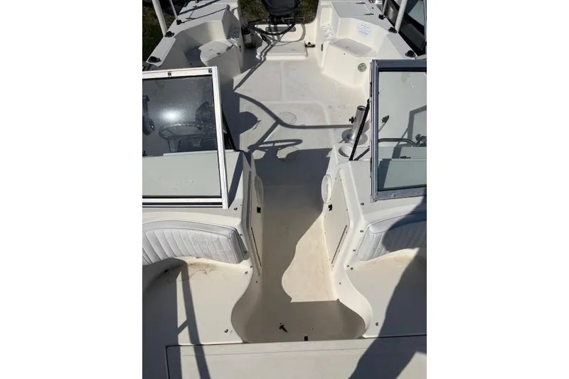 Slide: The Image of 2001 Sea Pro 190 Dual Console boat interior with seating and console view. - 11