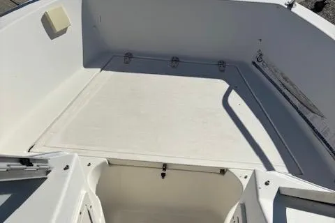 Slide: The Image of 2001 Sea Pro 190 Dual Console boat interior, featuring spacious seating and storage area. - 8