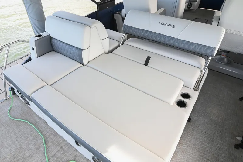 Slide: The Image of Luxurious seating on 2021 Harris Sunliner 230 boat with cup holders. - 12
