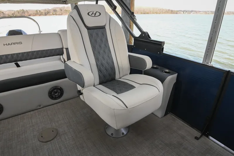 Slide: The Image of Luxury seating on 2021 Harris Sunliner 230 boat, featuring elegant design and lake view. - 29