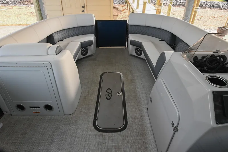 Slide: The Image of Interior of a 2021 Harris Sunliner 230 pontoon boat with spacious seating. - 38