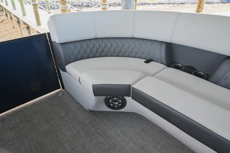 Slide: The Image of Luxurious seating on 2021 Harris Sunliner 230 pontoon boat with cup holders and speaker. - 43