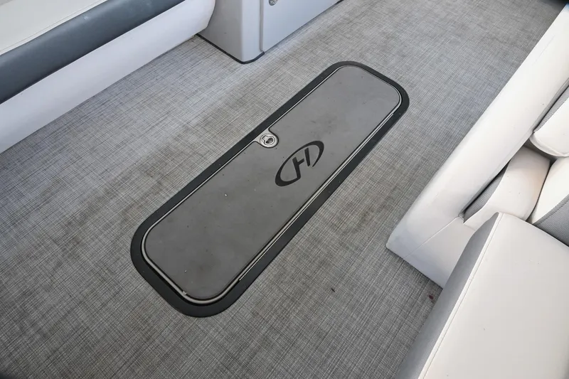 Slide: The Image of Harris Sunliner 230 boat floor storage compartment, 2021 model, with sleek design and durable materials. - 44