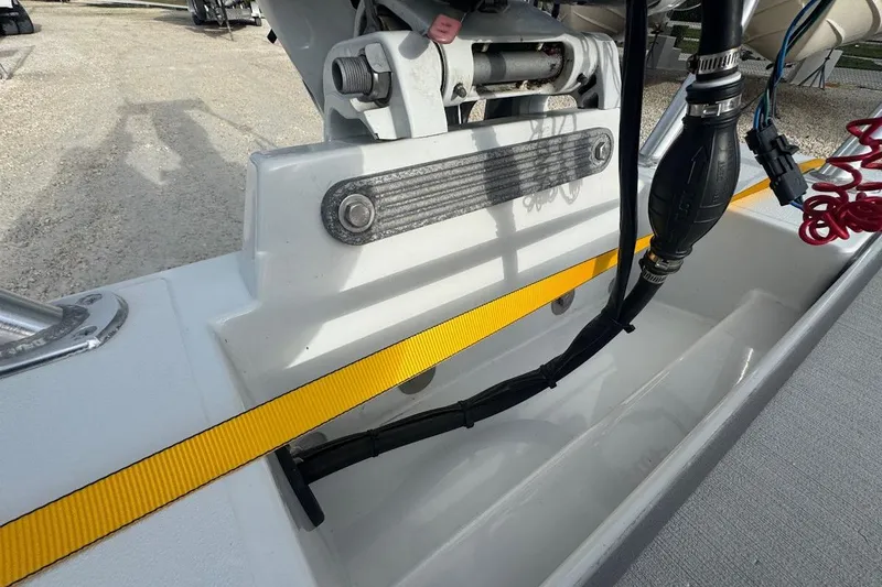 Slide: The Image of 2021 East Cape Glide boat detail showing engine mount and fuel line. - 4