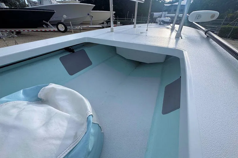 Slide: The Image of 2021 East Cape Glide boat interior with light blue and white design. - 8