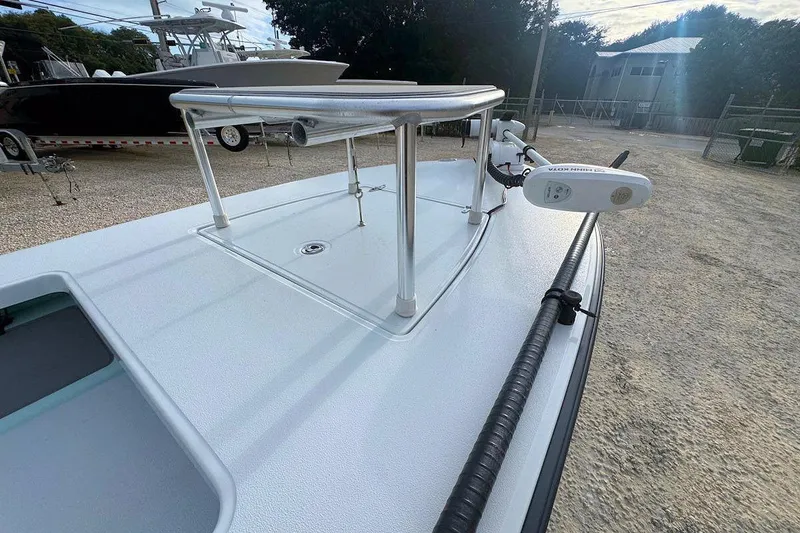Slide: The Image of 2021 East Cape Glide boat deck with mounted equipment, parked outdoors. - 9