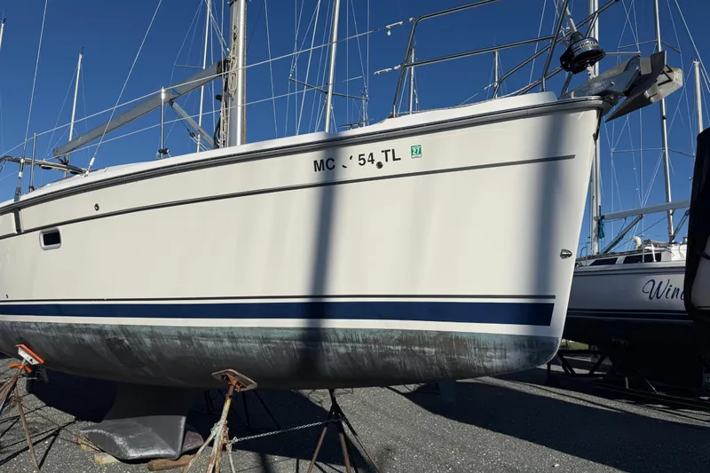 Slide: The Image of 2011 Hunter 39 sailboat on stands, with clear blue sky background. - 14