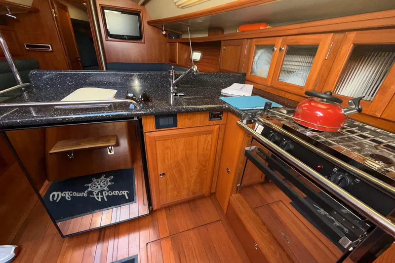 Slide: The Image of Interior view of a 2011 Hunter 39 yacht galley. - 16