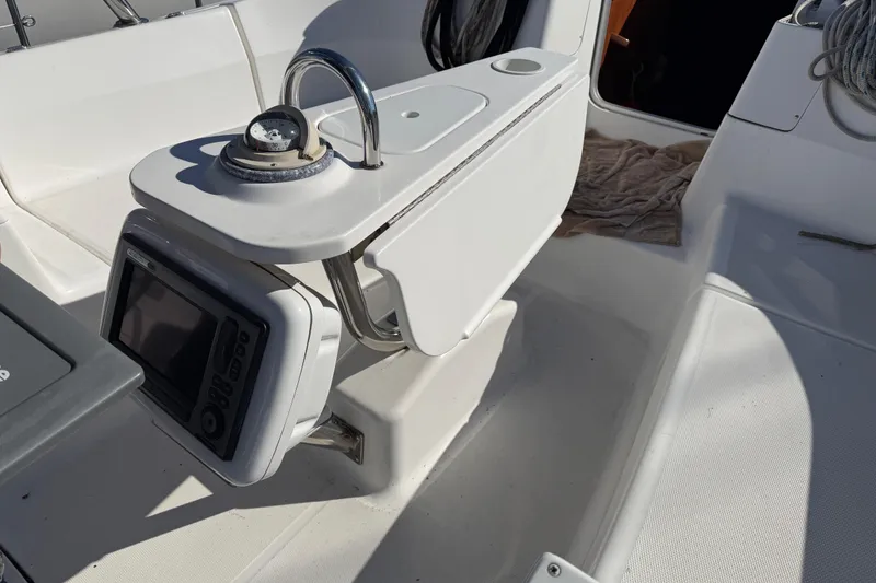 Slide: The Image of Cockpit of 2011 Hunter 39 sailboat with navigation equipment and compass. - 34