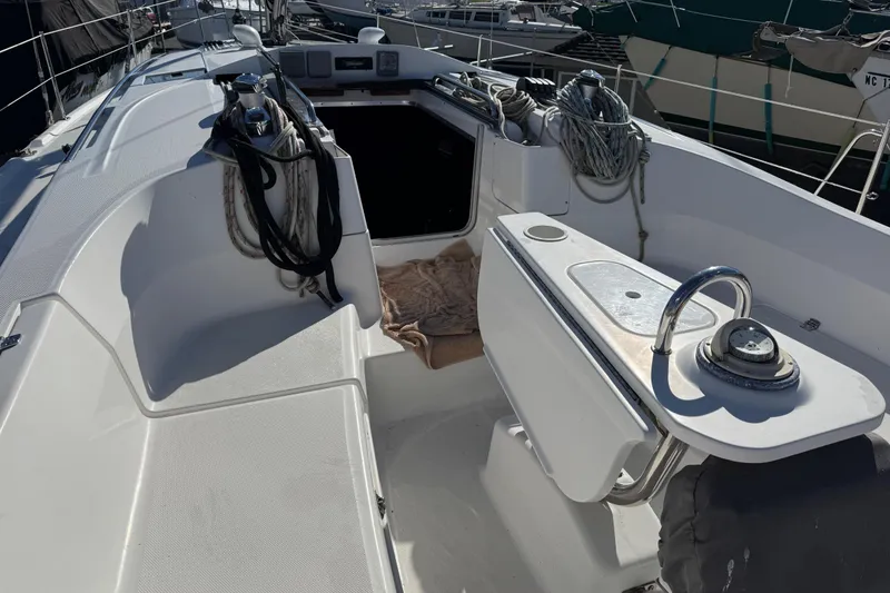 Slide: The Image of Cockpit of a 2011 Hunter 39 sailboat with ropes and steering wheel. - 35