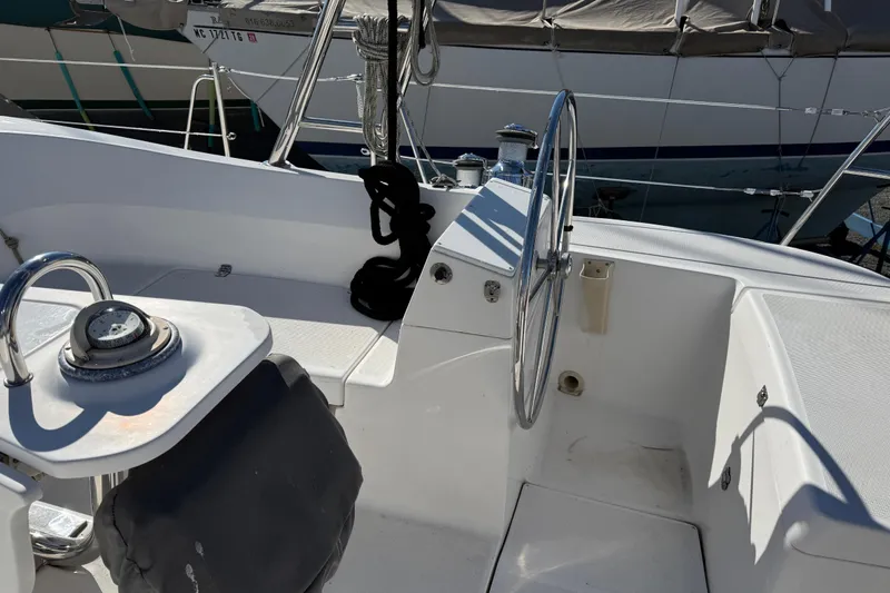 Slide: The Image of Cockpit of a 2011 Hunter 39 sailboat with steering wheel and nautical equipment. - 36