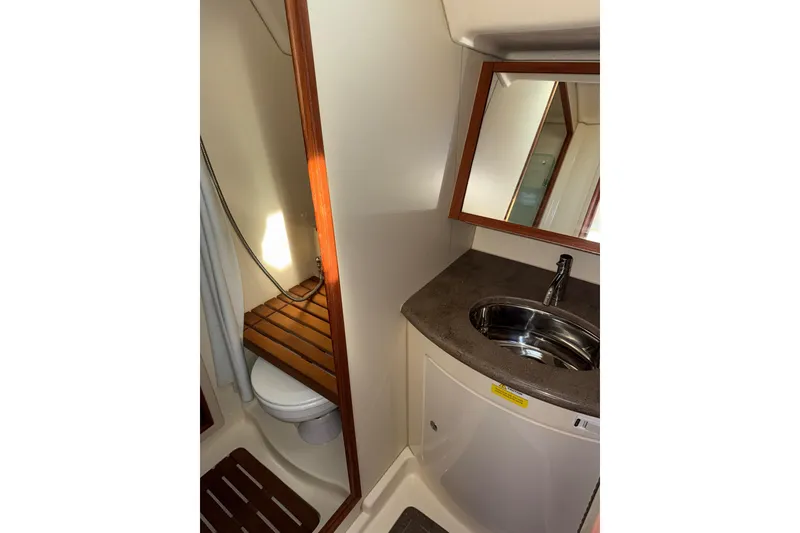 Slide: The Image of Interior of 2011 Hunter 39 yacht bathroom with sink, mirror, and toilet. - 37