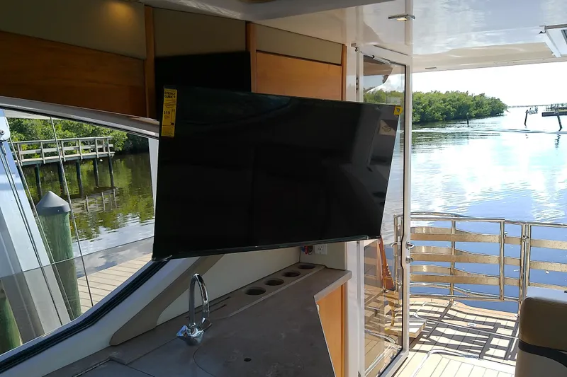 Slide: The Image of Interior of 2019 Floe Craft 3950C Aquafina yacht with TV and water view. - 20