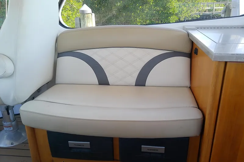 Slide: The Image of 2019 Floe Craft 3950C Aquafina interior seating with beige upholstery and wooden accents. - 24