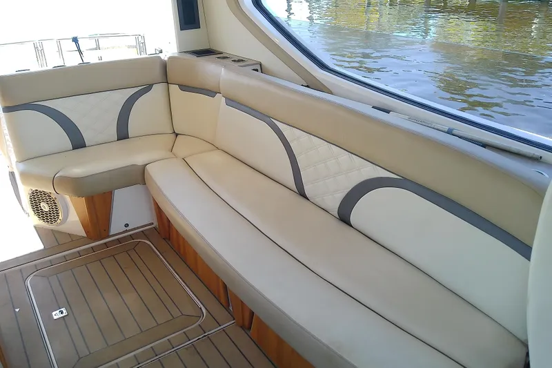 Slide: The Image of 2019 Floe Craft 3950C Aquafina boat interior with beige seating and wood flooring. - 26