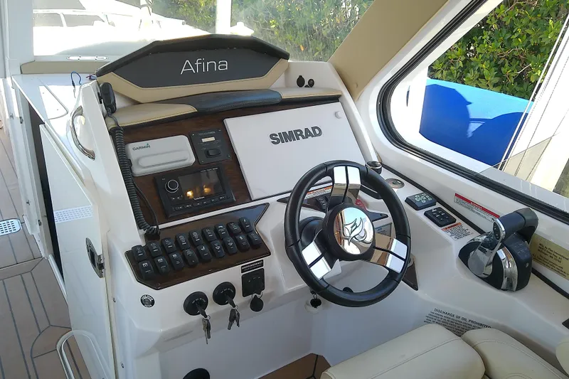 Slide: The Image of Cockpit of 2019 Floe Craft 3950C Aquafina with advanced navigation controls. - 32