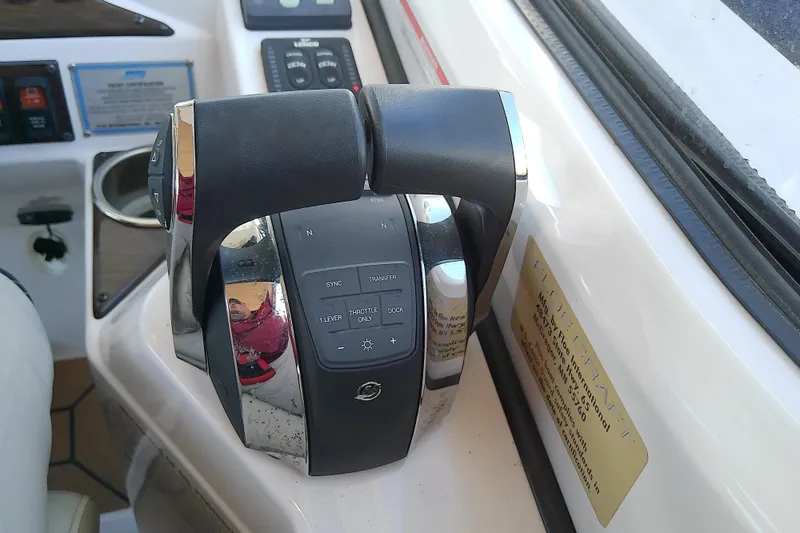 Slide: The Image of Throttle controls on a 2019 Floe Craft 3950C Aquafina boat dashboard. - 34