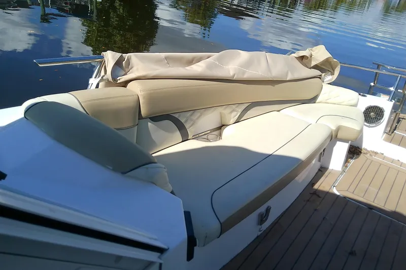 Slide: The Image of Luxurious seating on 2019 Floe Craft 3950C Aquafina boat, docked by calm water. - 49