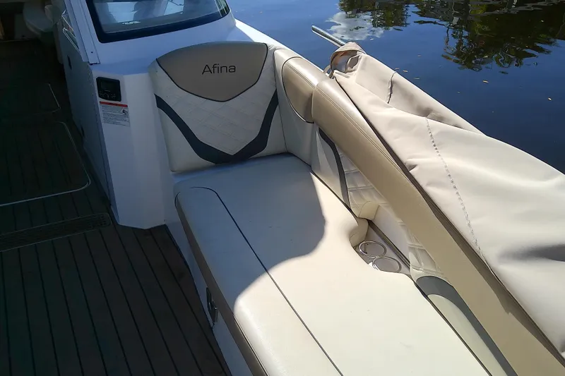 Slide: The Image of 2019 Floe Craft 3950C Aquafina boat interior with beige seating and water view. - 51