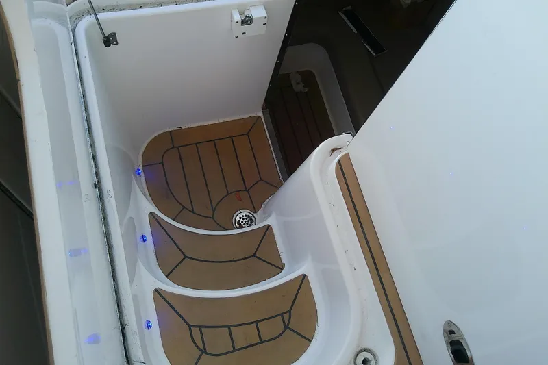 Slide: The Image of 2019 Floe Craft 3950C Aquafina boat interior with wooden steps and blue LED lights. - 64
