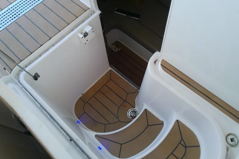 Slide: The Image of 2019 Floe Craft 3950C Aquafina boat interior with teak flooring and drainage system. - 65