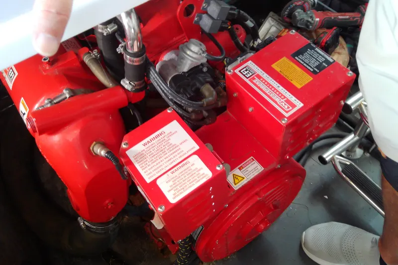 Slide: The Image of Engine compartment of 2019 Floe Craft 3950C Aquafina, featuring red mechanical components. - 79